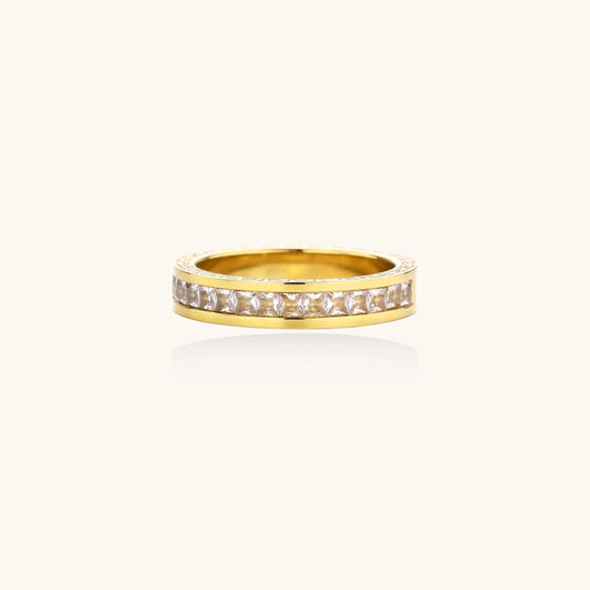14K gold plated ring with channel-set zirconia stones and Greek key pattern engraved on sides on white background