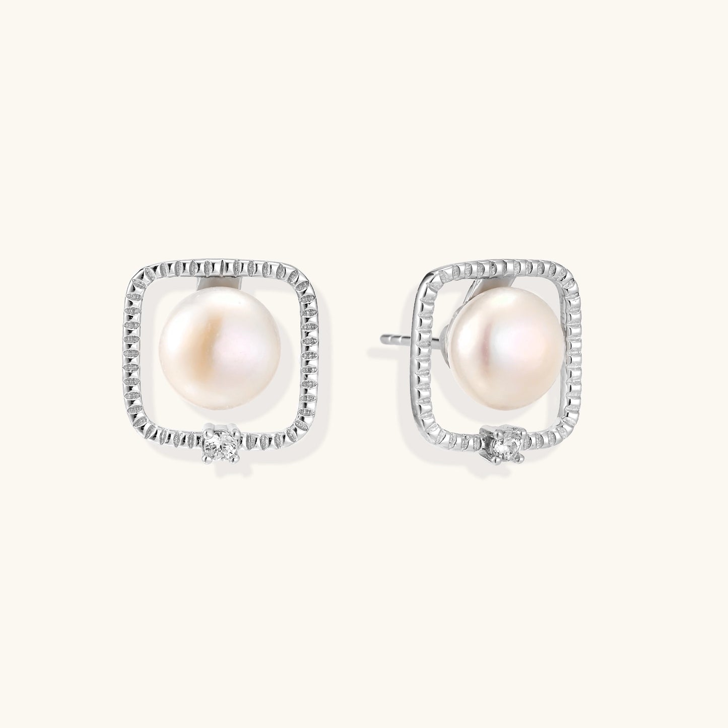 Square sterling silver stud earrings with freshwater pearls and crystal accents on white background.