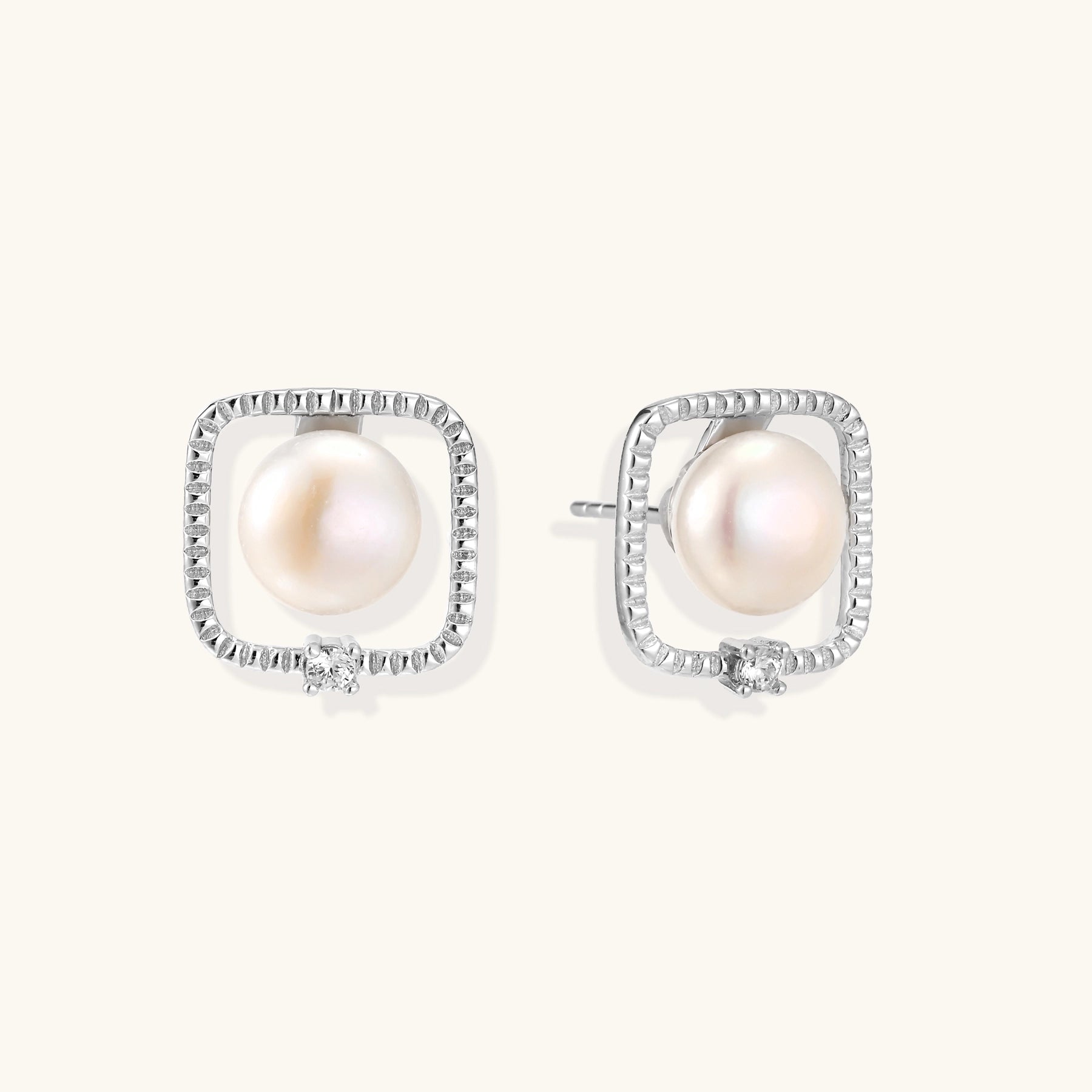 Square sterling silver stud earrings with freshwater pearls and crystal accents on white background.