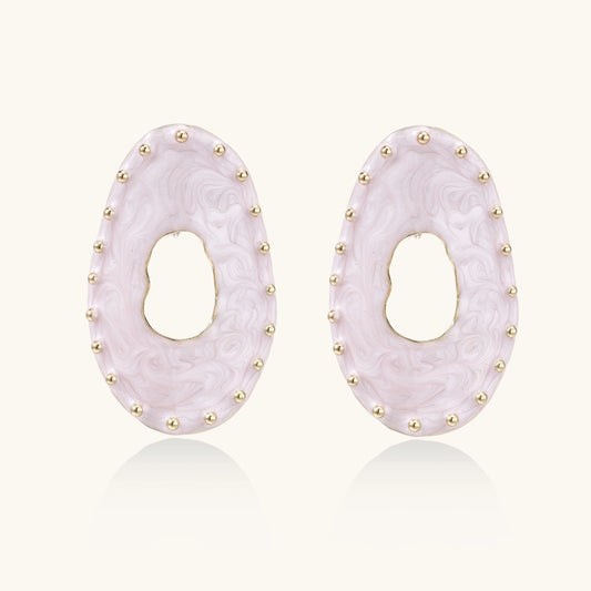 Oval lavender enamel earrings with gold studs around perimeter and cutout centers on white background